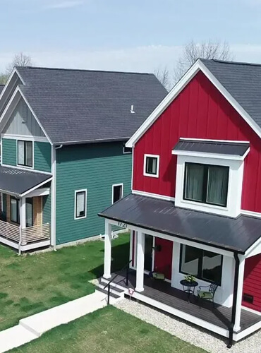 Overhead view of vibrant residential homes maintained by Omega Maintenance Solutions, showcasing their expertise in residential property management